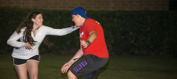 Elise Karriker, left, tags Andrew Todd during a flag football game.